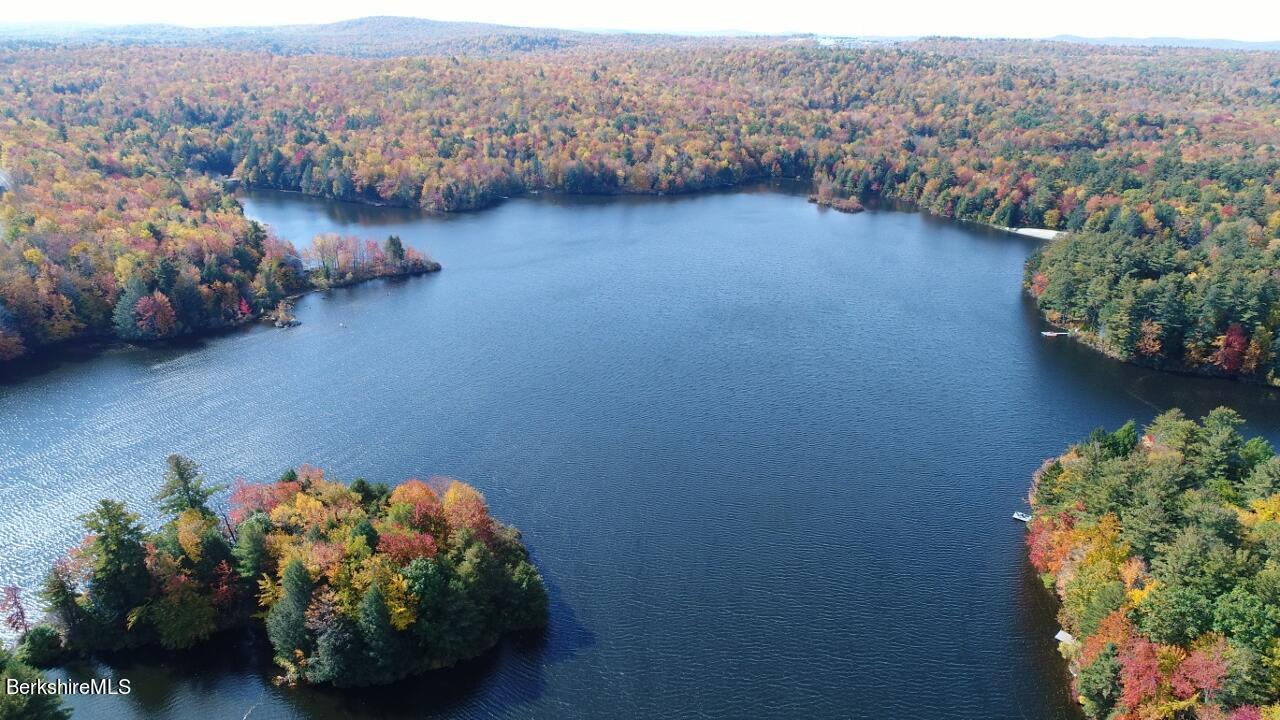 795 Moberg Road Becket, MA 01223 - Photo 38 of 41 an aerial view of a house with a yard and lake view