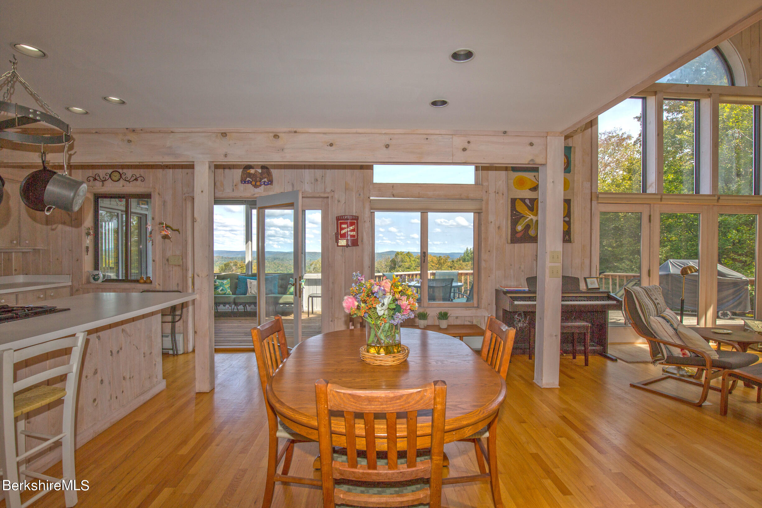 795 Moberg Road Becket, MA 01223 - Photo 6 of 41 a view of a dining room with furniture window and wooden floor