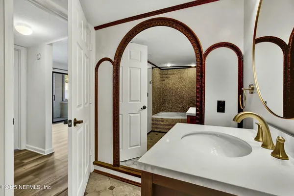 a bathroom with a sink and a mirror
