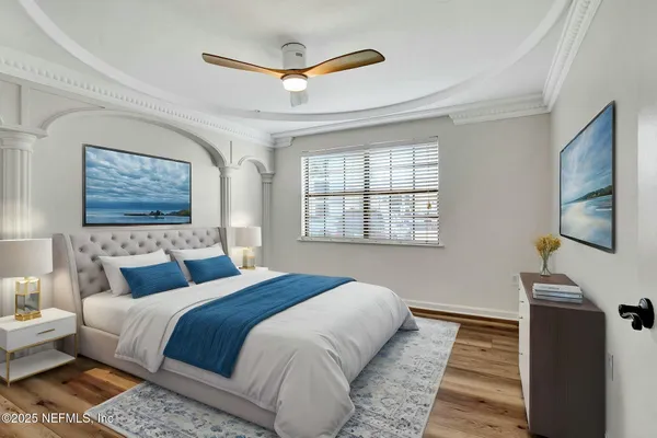 a bedroom with a bed lamp and a window