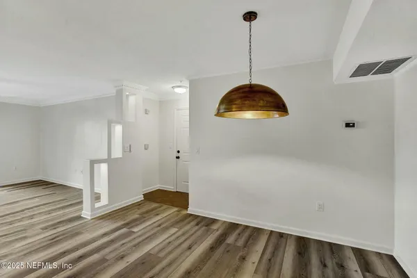 a view of a livingroom with wooden floor