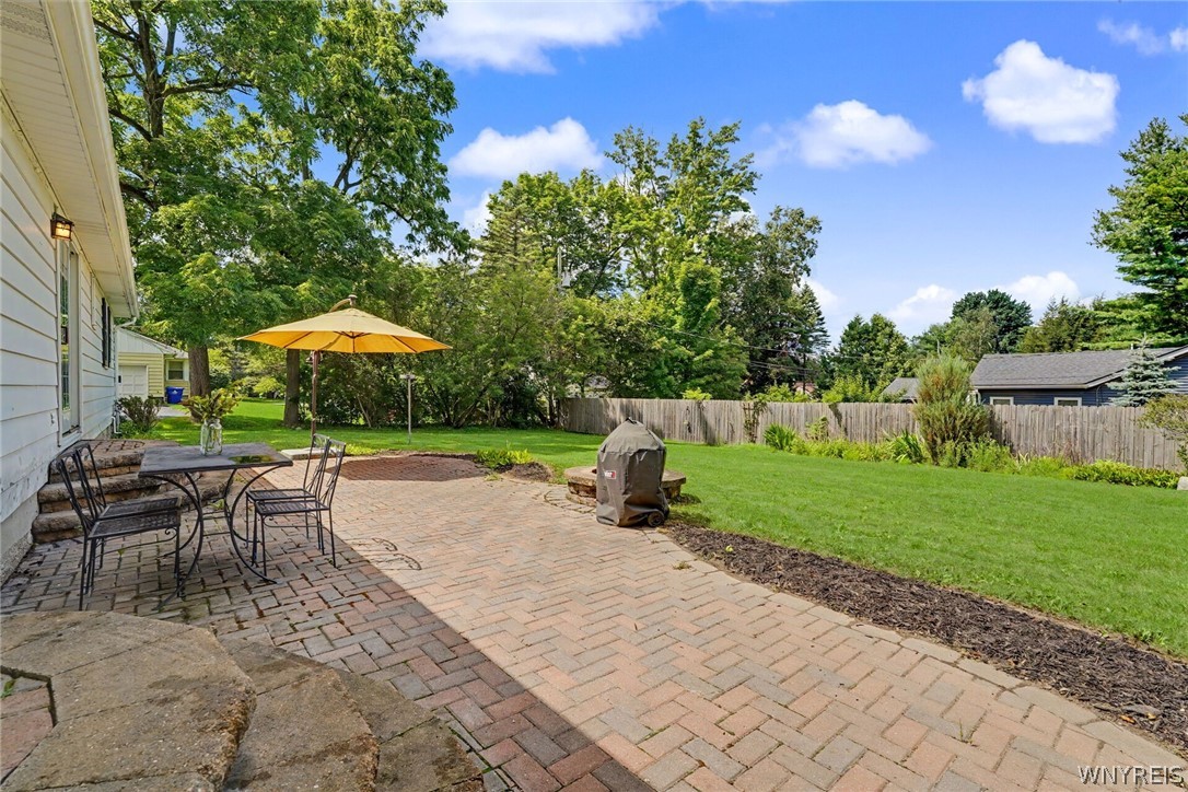 4685 Sawmill Road Clarence, NY 14031 - Photo 38 of 38 Paver patio with fireplace to enjoy late nights, or gatherings.