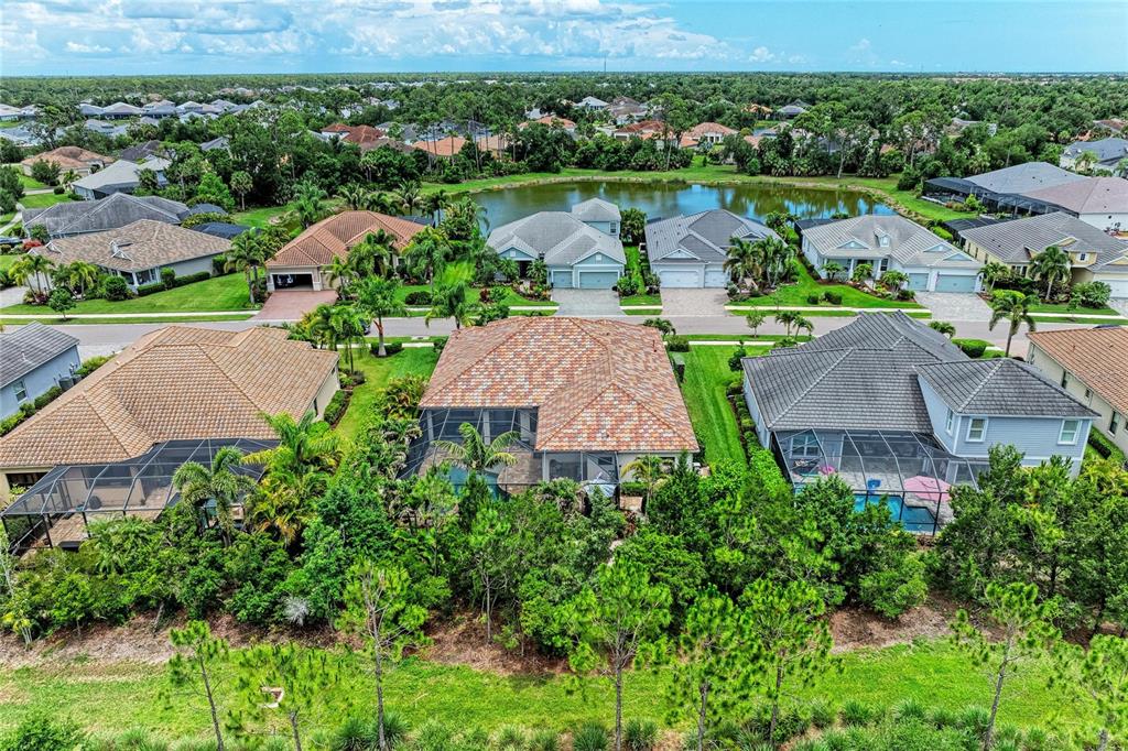 12642 Harney Street Venice, FL 34293 - Photo 53 of 85 an aerial view of lake residential house and outdoor space