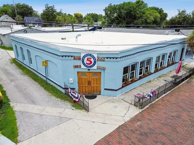a view of a patio with a table and chairs