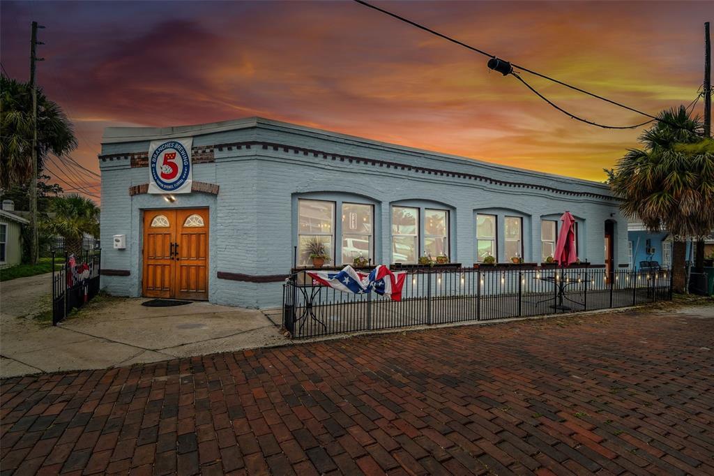 131 Hibiscus Street Tarpon Springs, FL 34689 - Photo 3 of 11 a view of a house with a patio