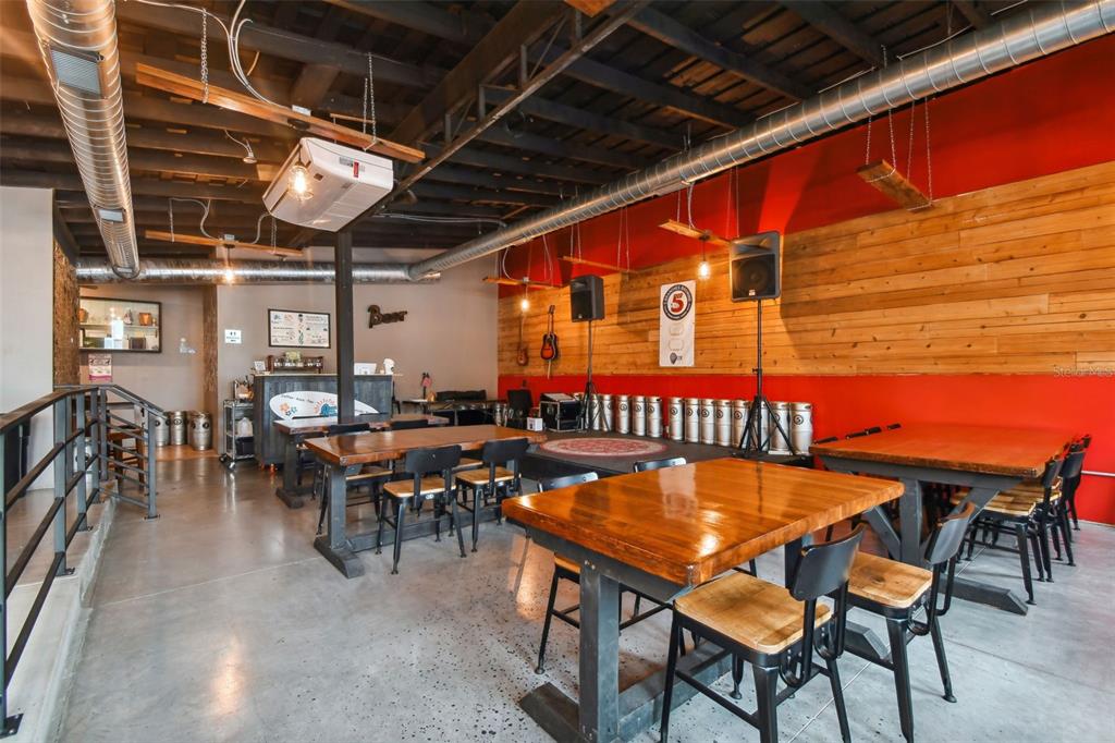 131 Hibiscus Street Tarpon Springs, FL 34689 - Photo 5 of 11 a view of a chairs and table in a patio