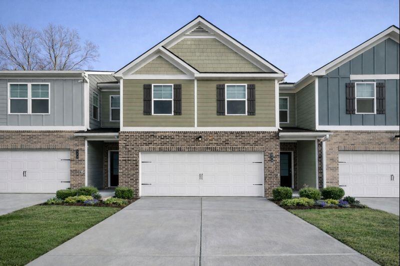 284 Switcher Court Union City, GA 30291 - Photo 1 of 36 a front view of a house with a garden and garage