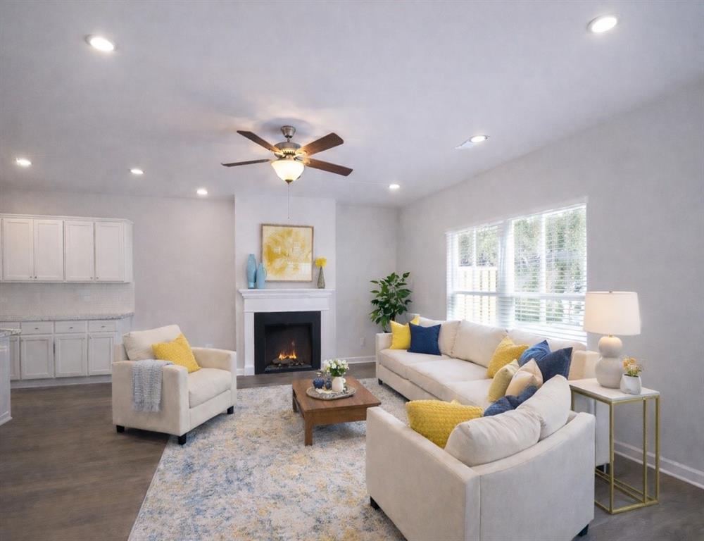 284 Switcher Court Union City, GA 30291 - Photo 3 of 36 a living room with furniture garden view and a fireplace