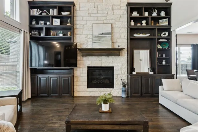 a living room with furniture and a fireplace