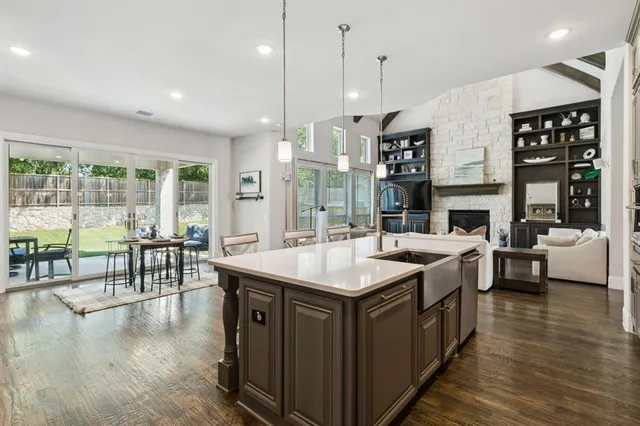 a open kitchen with a table and chairs in it
