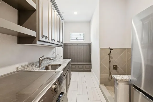 a kitchen with a sink and a refrigerator