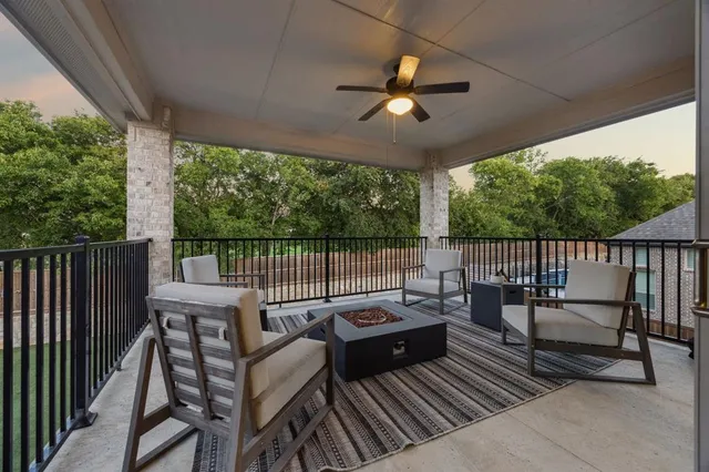 a view of a balcony with furniture