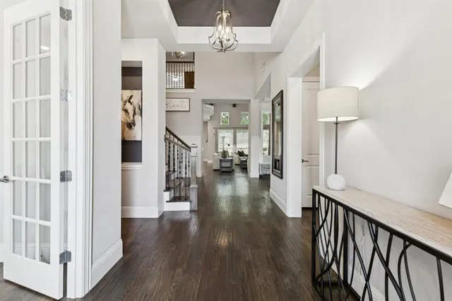 a view of a hallway view with wooden floor and staircase
