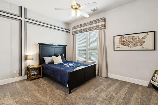 a bed room with a bed and a chandelier