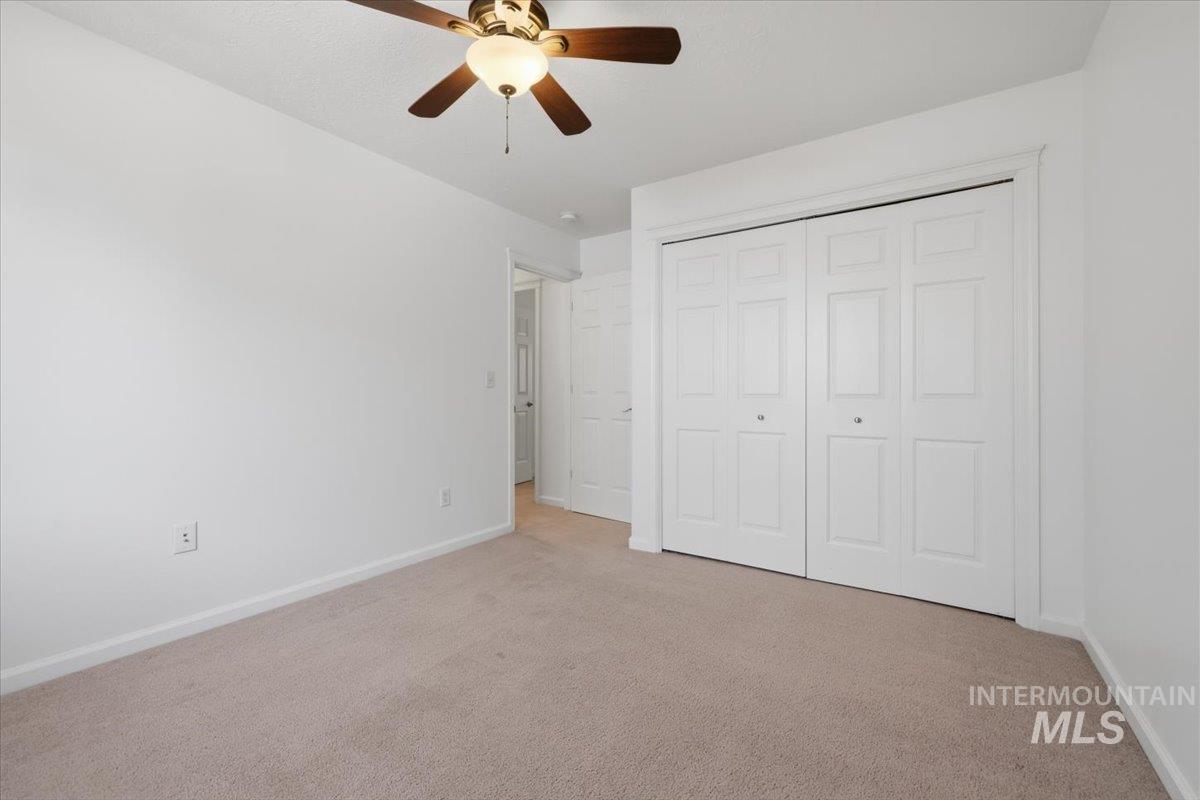 2075 North Springland Place Boise, ID 83713 - Photo 33 of 49 Neutral-toned carpeting and white walls create a versatile interior