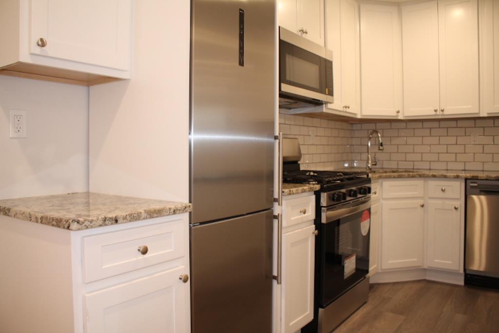 80 William Street, Unit 3F Mount Vernon, NY 10552 - Photo 1 of 1 a kitchen with granite countertop cabinets stainless steel appliances and a counter space