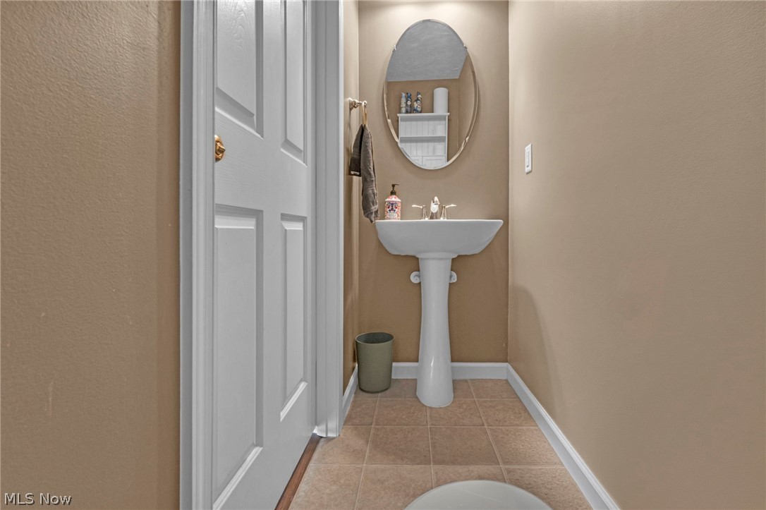 147 Stone Ridge Way Berea, OH 44017 - Photo 17 of 44 Bathroom with light tile patterned floors and a textured wall