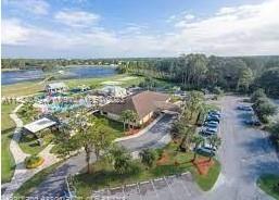 6868 Pinta Drive Sebring, FL 33872 - Photo 7 of 14 a view of a lake with houses in back
