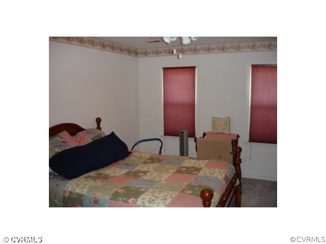 11501 Corte Castle Road Chesterfield, VA 23838 - Photo 4 of 12 a bed room with a bed and a dresser