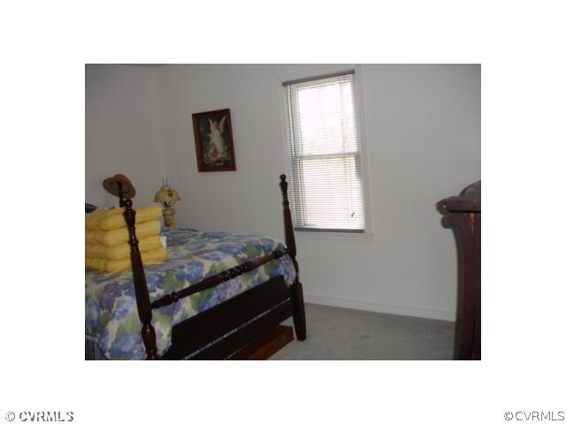 11501 Corte Castle Road Chesterfield, VA 23838 - Photo 5 of 12 a room with a bed and a window