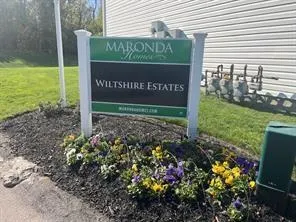 a sign on the side of the road