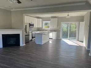 a view of kitchen with sink and fireplace