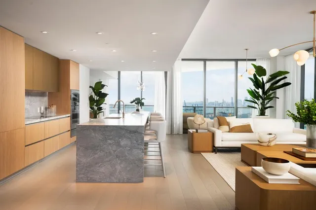 a living room with furniture and a floor to ceiling window