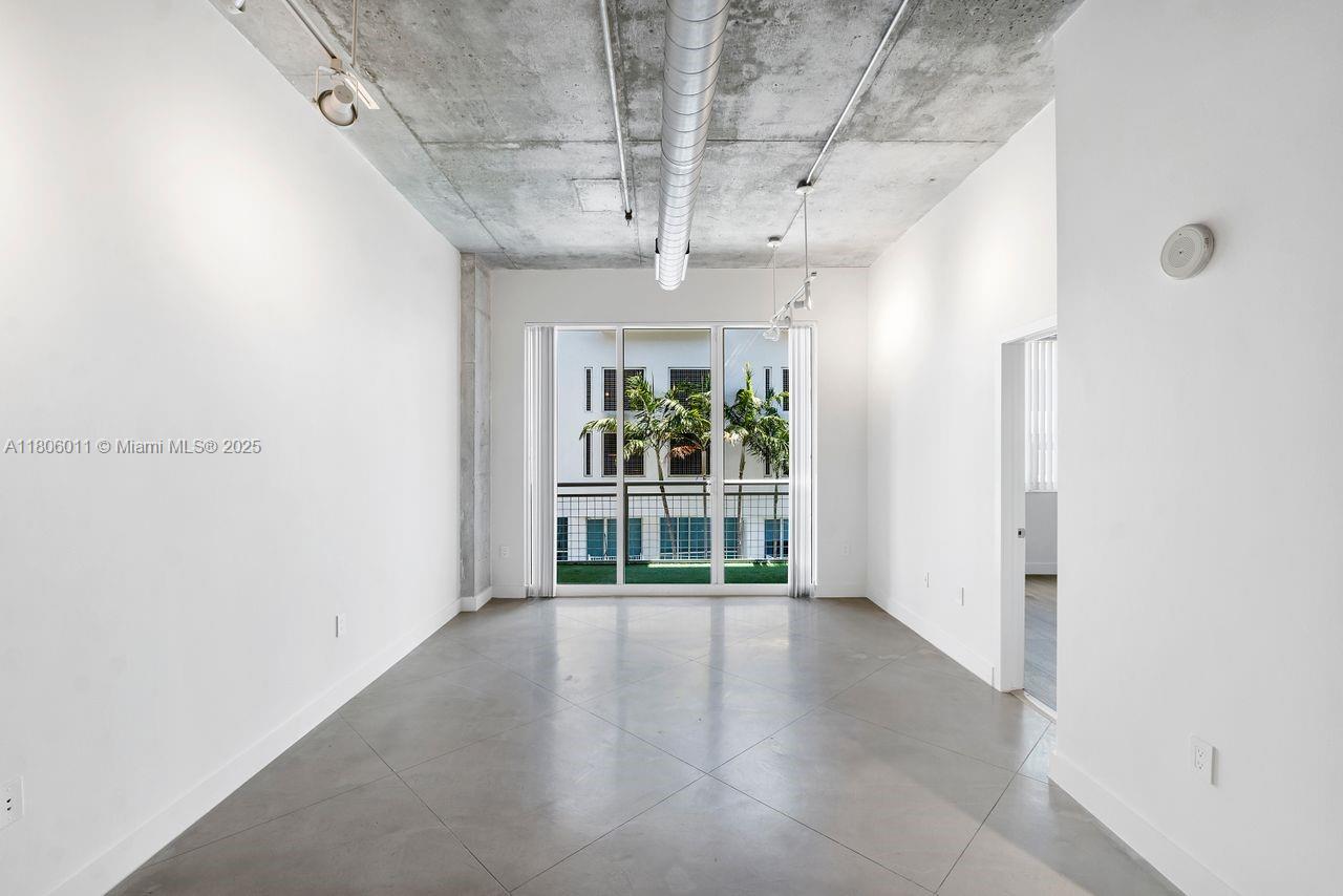 2001 Biscayne Boulevard, Unit 2308 Miami, FL 33137 - Photo 12 of 29 a view of an empty room with a window