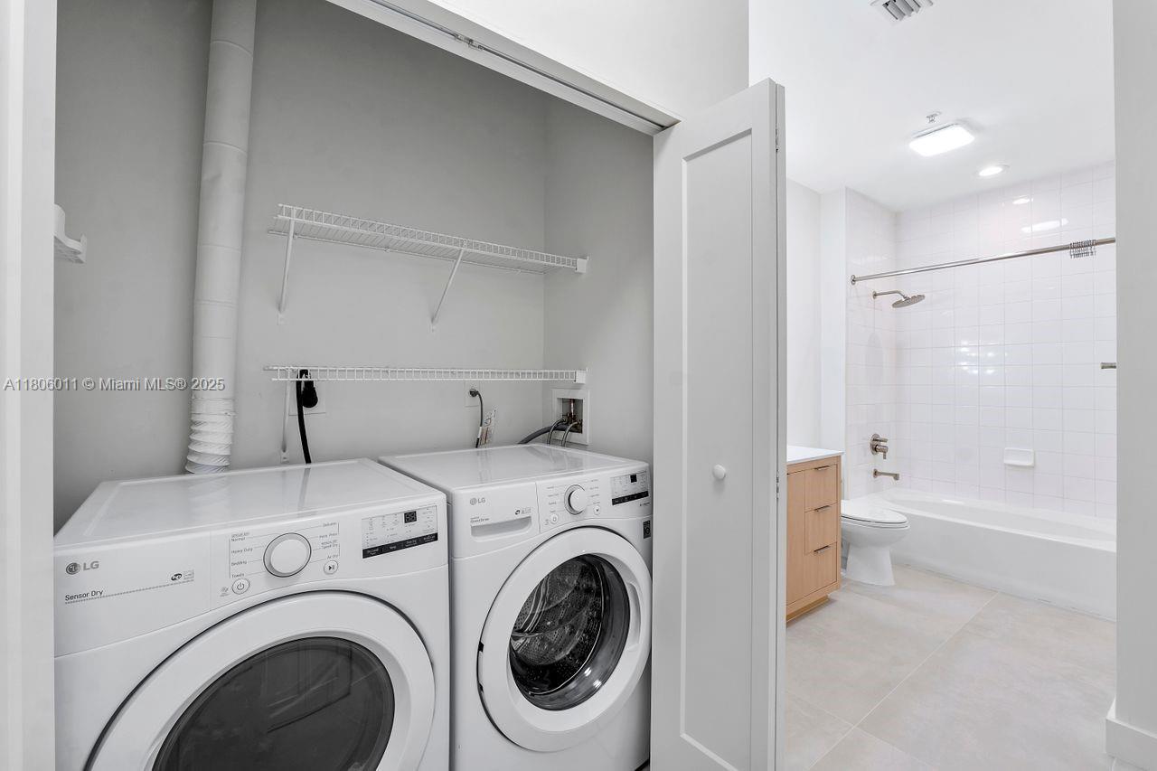 2001 Biscayne Boulevard, Unit 2308 Miami, FL 33137 - Photo 19 of 29 a view of bathroom with washer and dryer