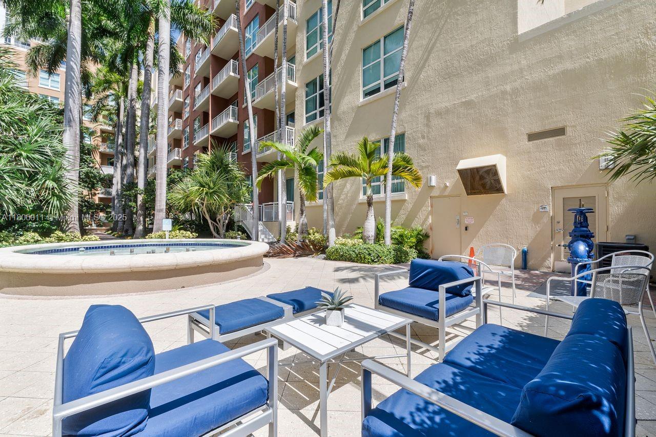 2001 Biscayne Boulevard, Unit 2308 Miami, FL 33137 - Photo 21 of 29 a view of a patio with couches and a potted plant on a table