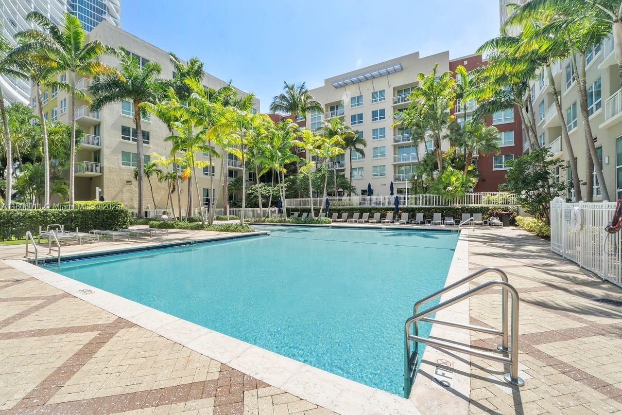 2001 Biscayne Boulevard, Unit 2308 Miami, FL 33137 - Photo 23 of 29 a view of swimming pool with chairs