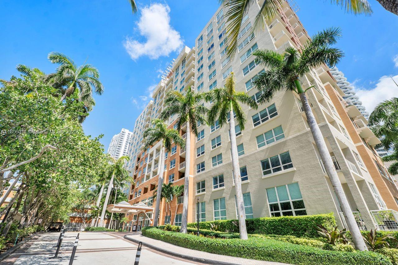 2001 Biscayne Boulevard, Unit 2308 Miami, FL 33137 - Photo 27 of 29 a view of a multi story residential apartment building with a yard and trampoline