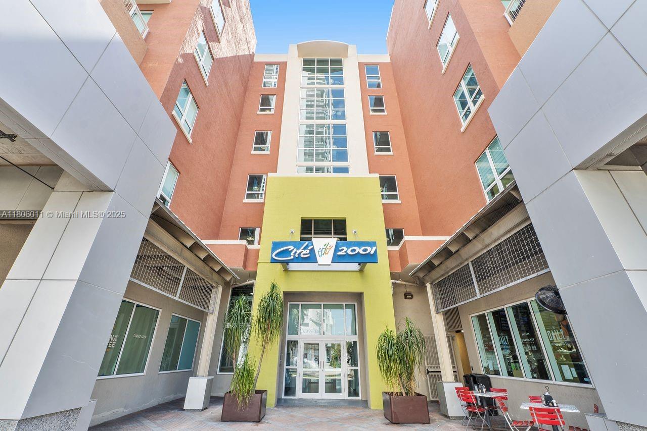 2001 Biscayne Boulevard, Unit 2308 Miami, FL 33137 - Photo 29 of 29 a front view of a residential apartment building with a yard