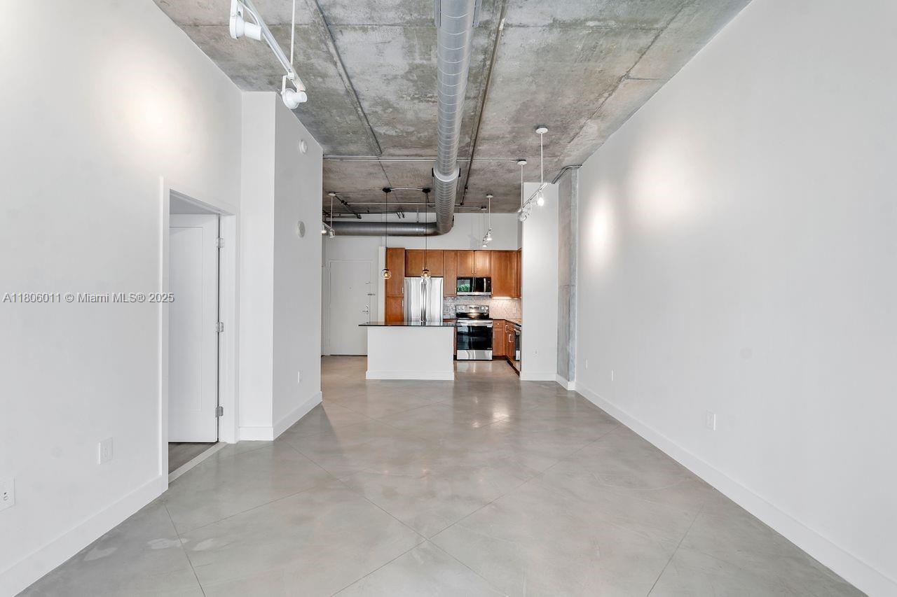 2001 Biscayne Boulevard, Unit 2308 Miami, FL 33137 - Photo 7 of 29 a view of a living room and kitchen