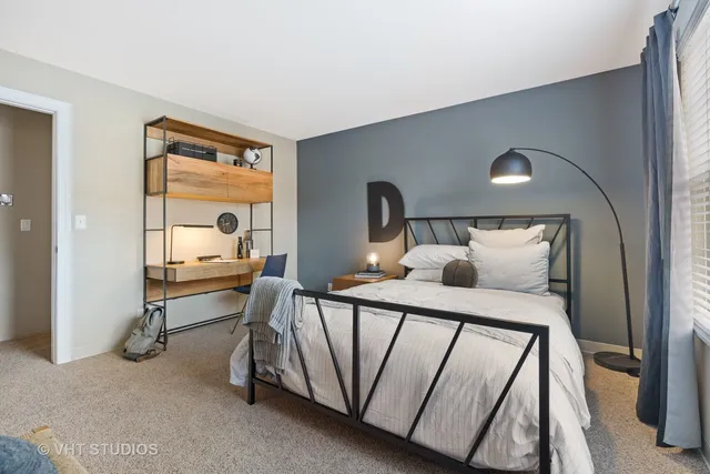 a bed room with a bed and a window