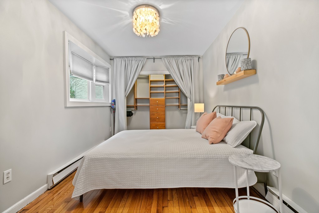 8 Dwight Street, Unit 1 Boston, MA 02118 - Photo 12 of 20 a bedroom with a bed and a window
