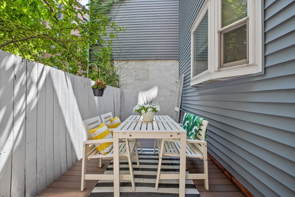8 Dwight Street, Unit 1 Boston, MA 02118 - Photo 16 of 20 a view of a chairs with a table in the balcony