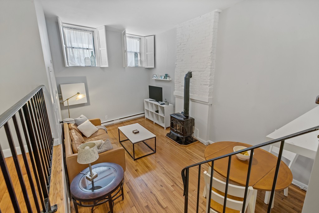 8 Dwight Street, Unit 1 Boston, MA 02118 - Photo 2 of 20 a view of a workspace with furniture and a window