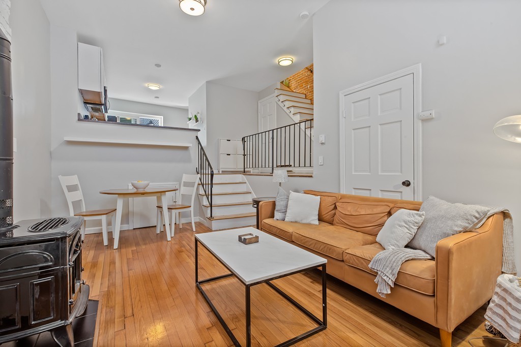 8 Dwight Street, Unit 1 Boston, MA 02118 - Photo 4 of 20 a living room with furniture and a wooden floor