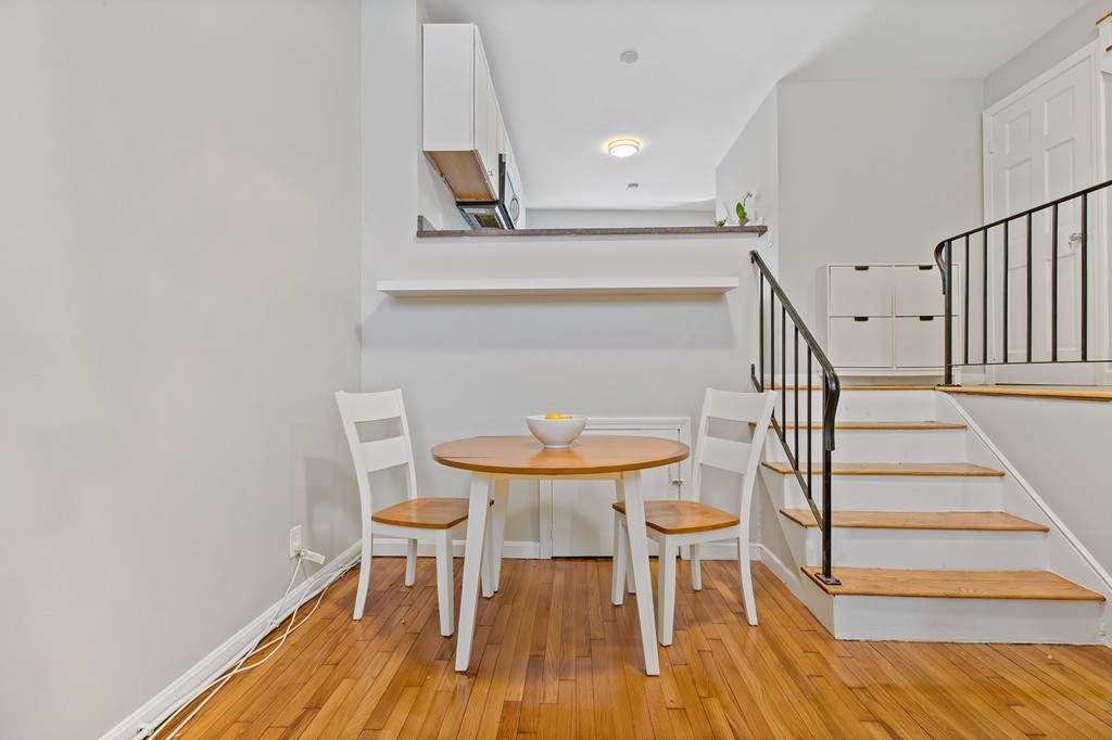 8 Dwight Street, Unit 1 Boston, MA 02118 - Photo 7 of 20 a view of dining room and hall with wooden floor