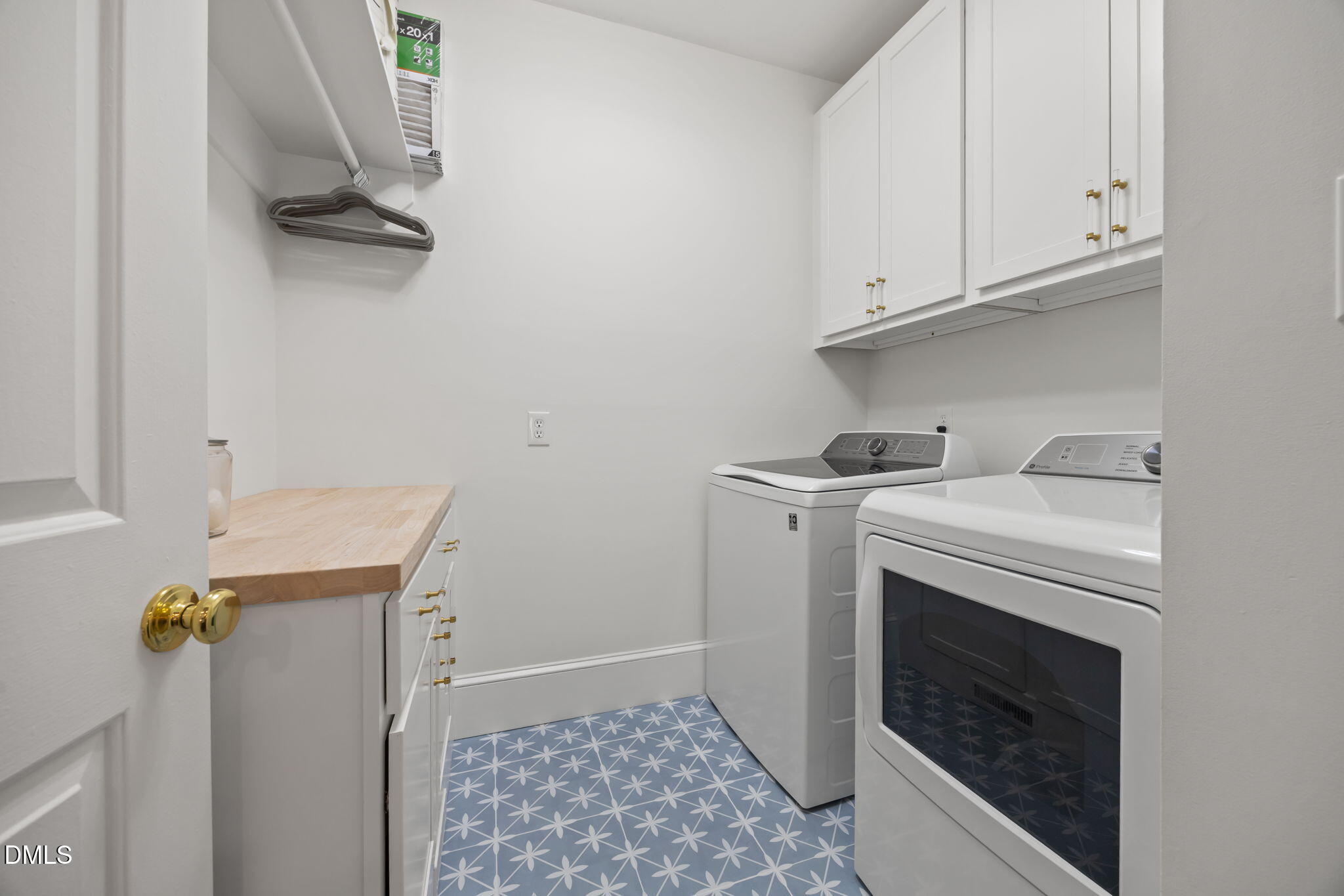 562 Weathergreen Drive Raleigh, NC 27615 - Photo 16 of 47 a view of storage and utility room with washer and dryer