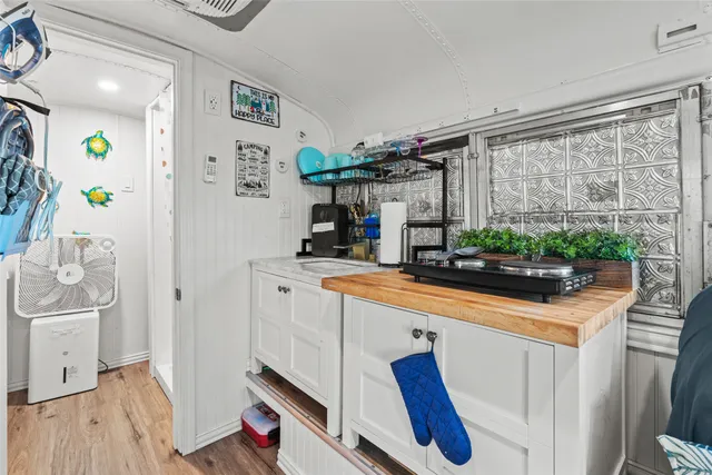 a kitchen with stainless steel appliances a sink and a refrigerator