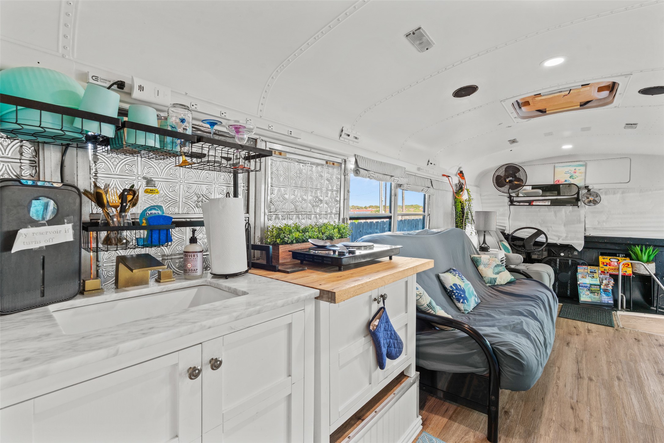1287 North Crystal Beach Road Crystal Beach, TX 77650 - Photo 17 of 45 a kitchen filled with a white stove top oven and cabinets