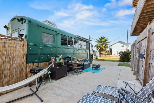 a view of a balcony with couches and wooden floor
