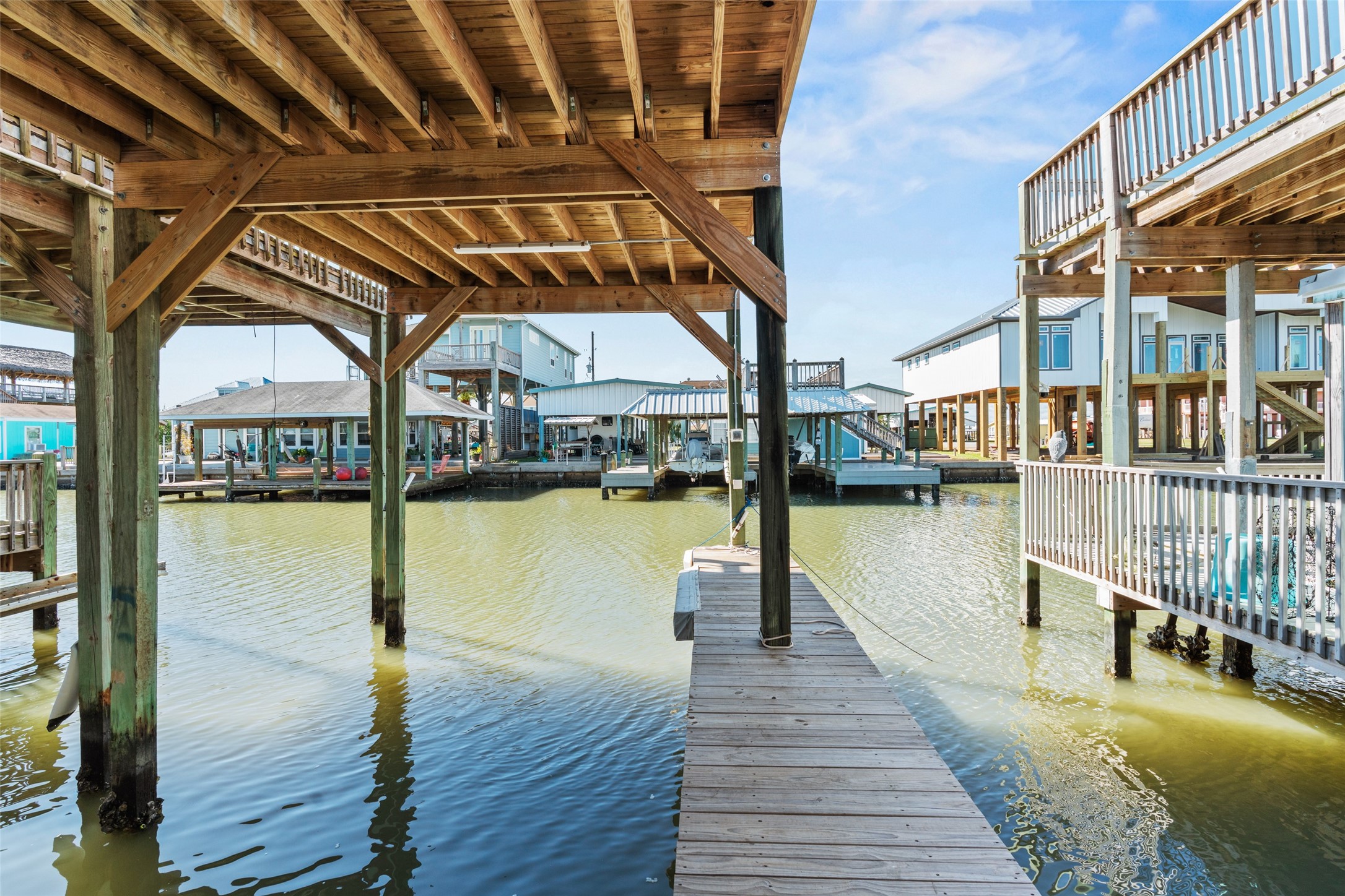1287 North Crystal Beach Road Crystal Beach, TX 77650 - Photo 44 of 45 a view of a swimming pool with deck