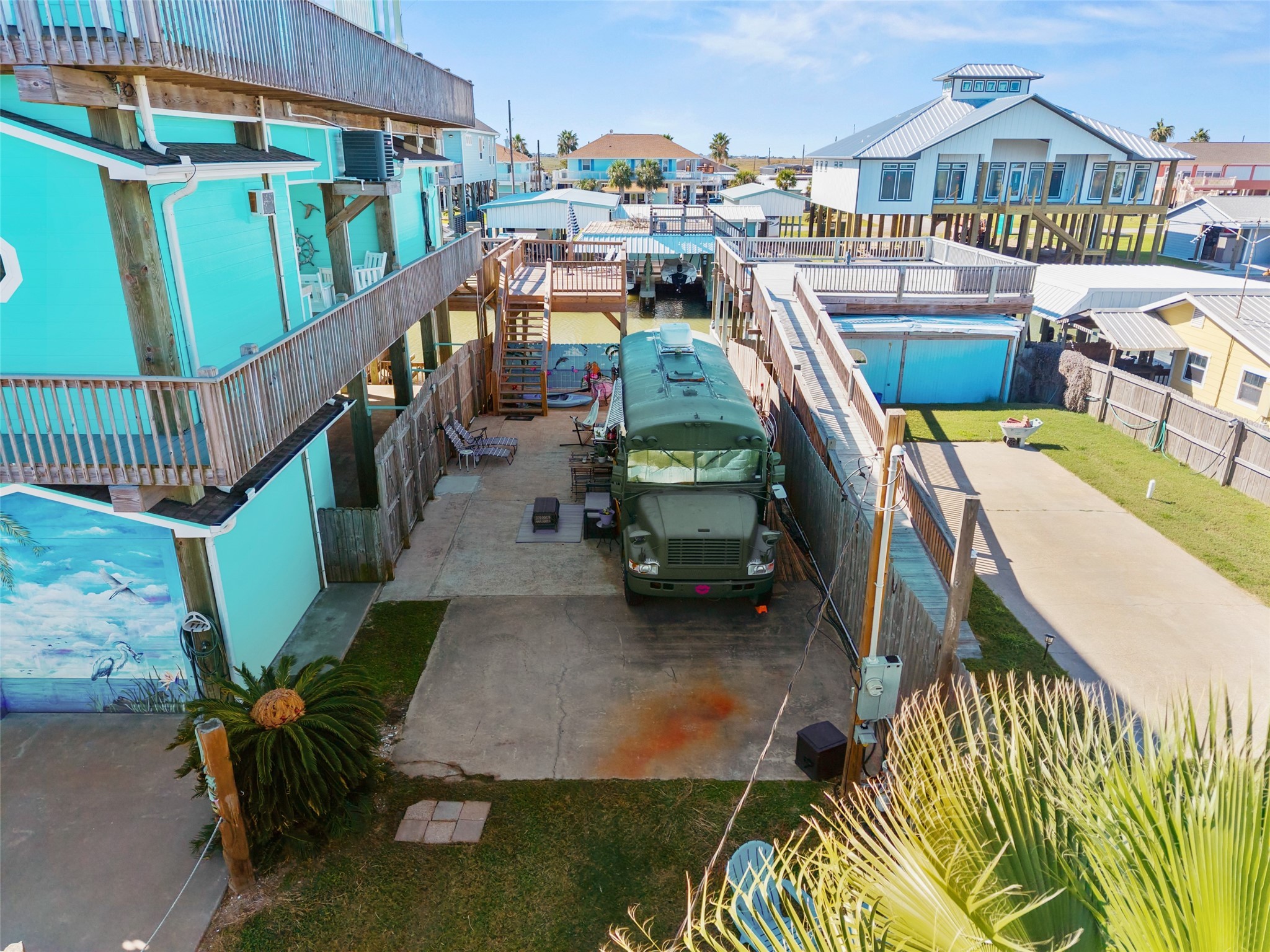 1287 North Crystal Beach Road Crystal Beach, TX 77650 - Photo 7 of 45 a view of a swimming pool with a patio and a garden