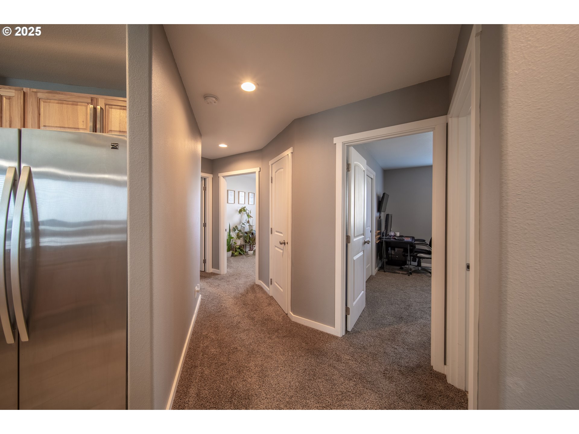 1010 Raechel Road Lakeside, OR 97449 - Photo 23 of 44 a view of a hallway with a livingroom and a bathroom sink
