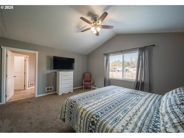 a view of a bedroom with a bed