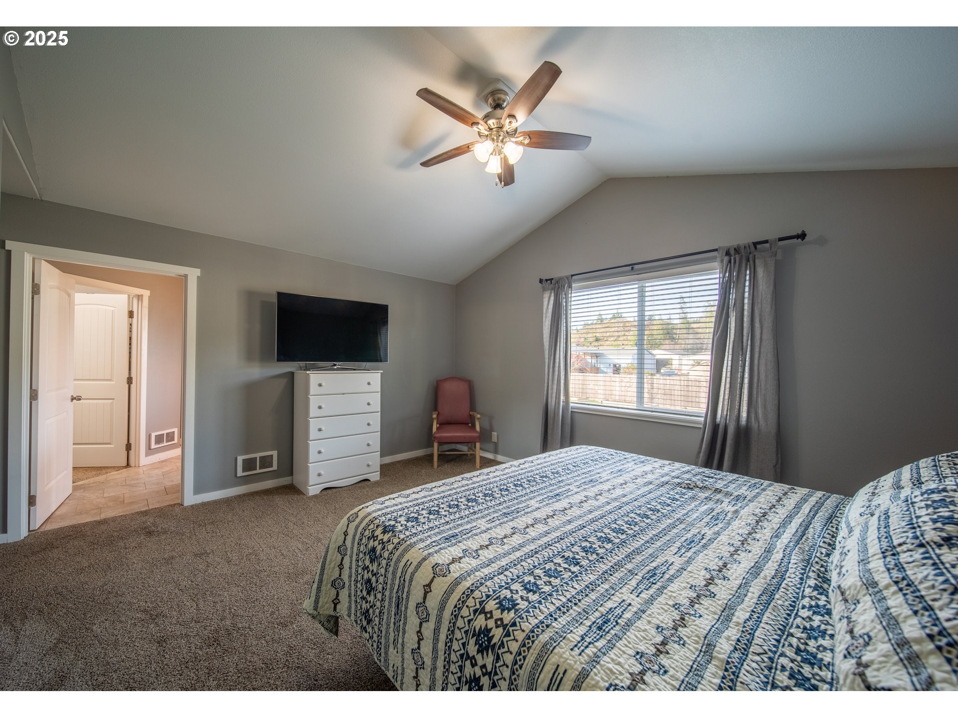 1010 Raechel Road Lakeside, OR 97449 - Photo 29 of 44 a bedroom with a bed and a tv