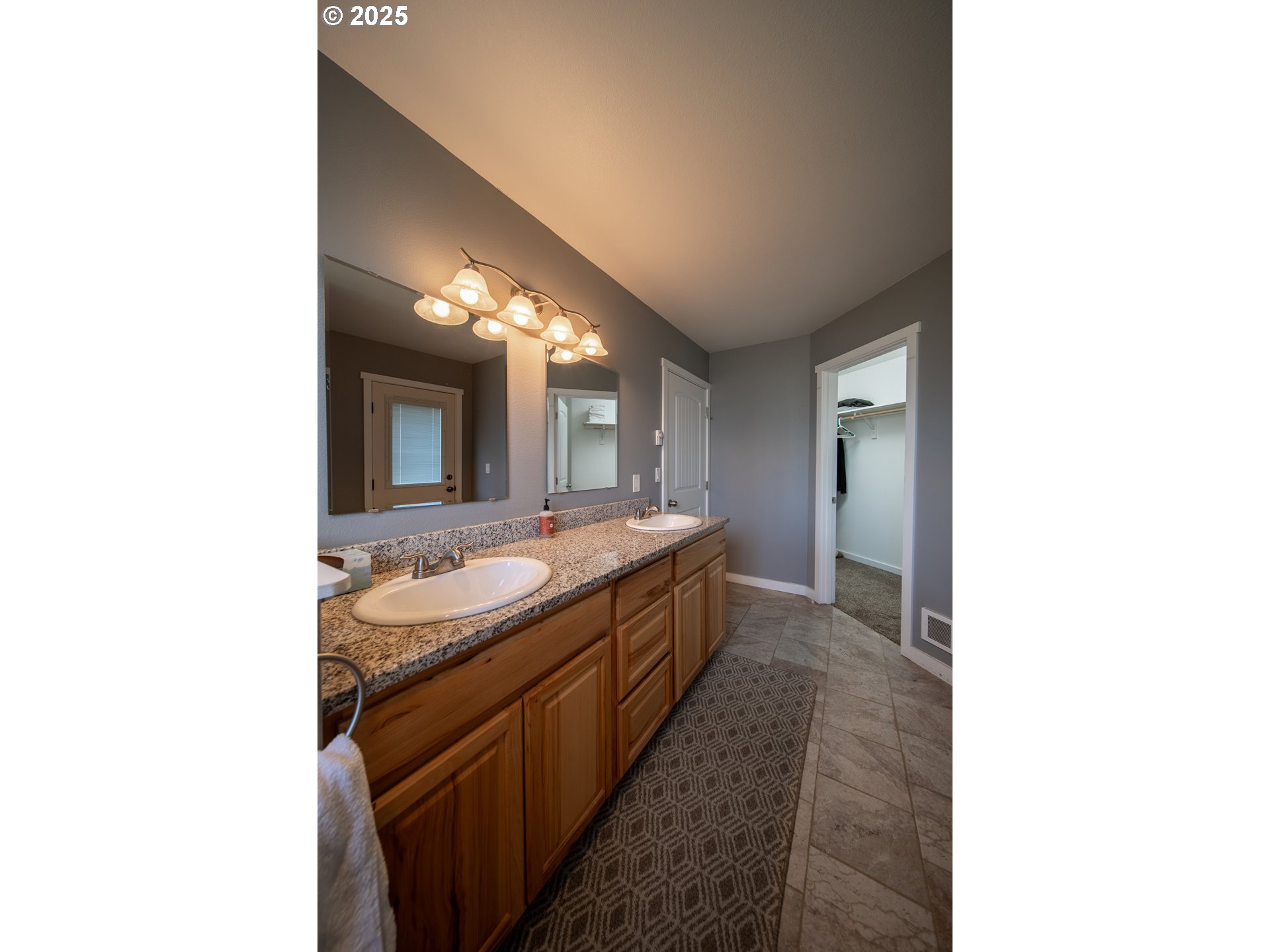 1010 Raechel Road Lakeside, OR 97449 - Photo 31 of 44 a bathroom with a sink and a mirror